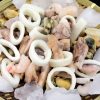 mix of squid rings, mussel meat, shrimps, octopus in a basket